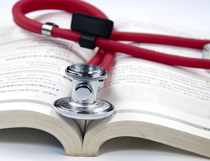 Stethoscope and Medical Textbook