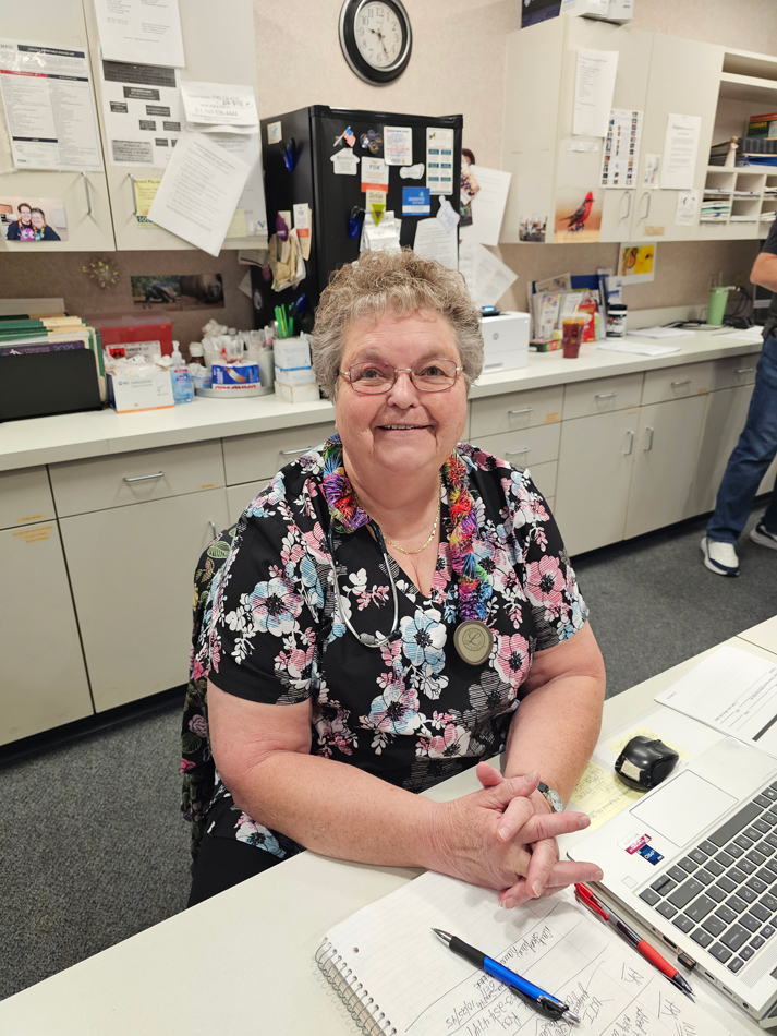 Picture of older nurse at a desk